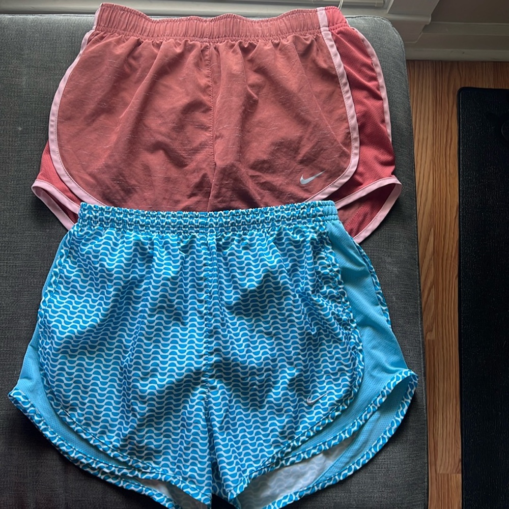Two pairs of Nike running shorts